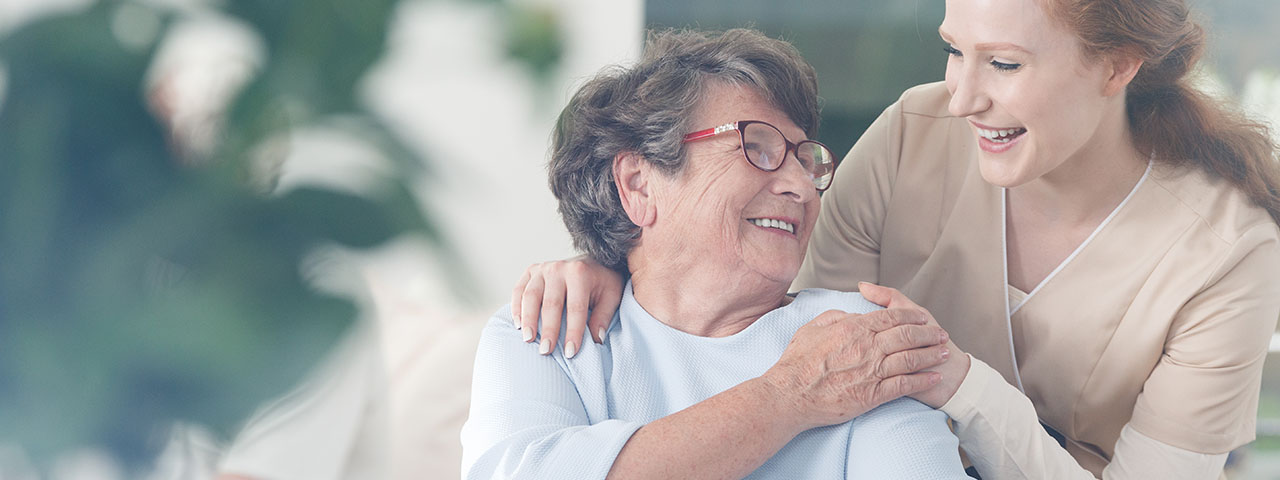 happy patient holding caregiver for a hand while spending time together
