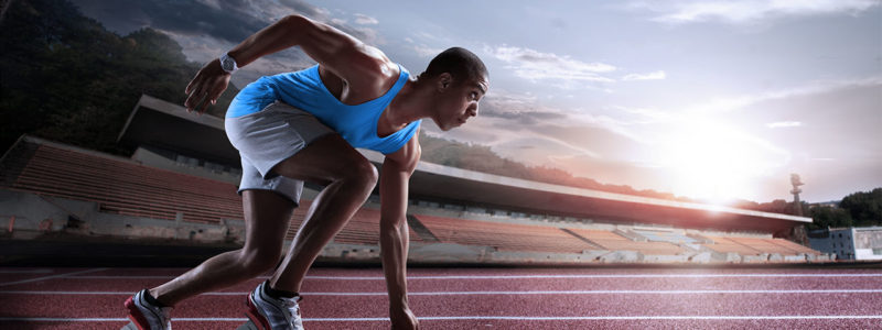 cosinuss-fitness-performance-sport-sprinter-leaving-starting-blocks-on-the-running-track_single_422100022