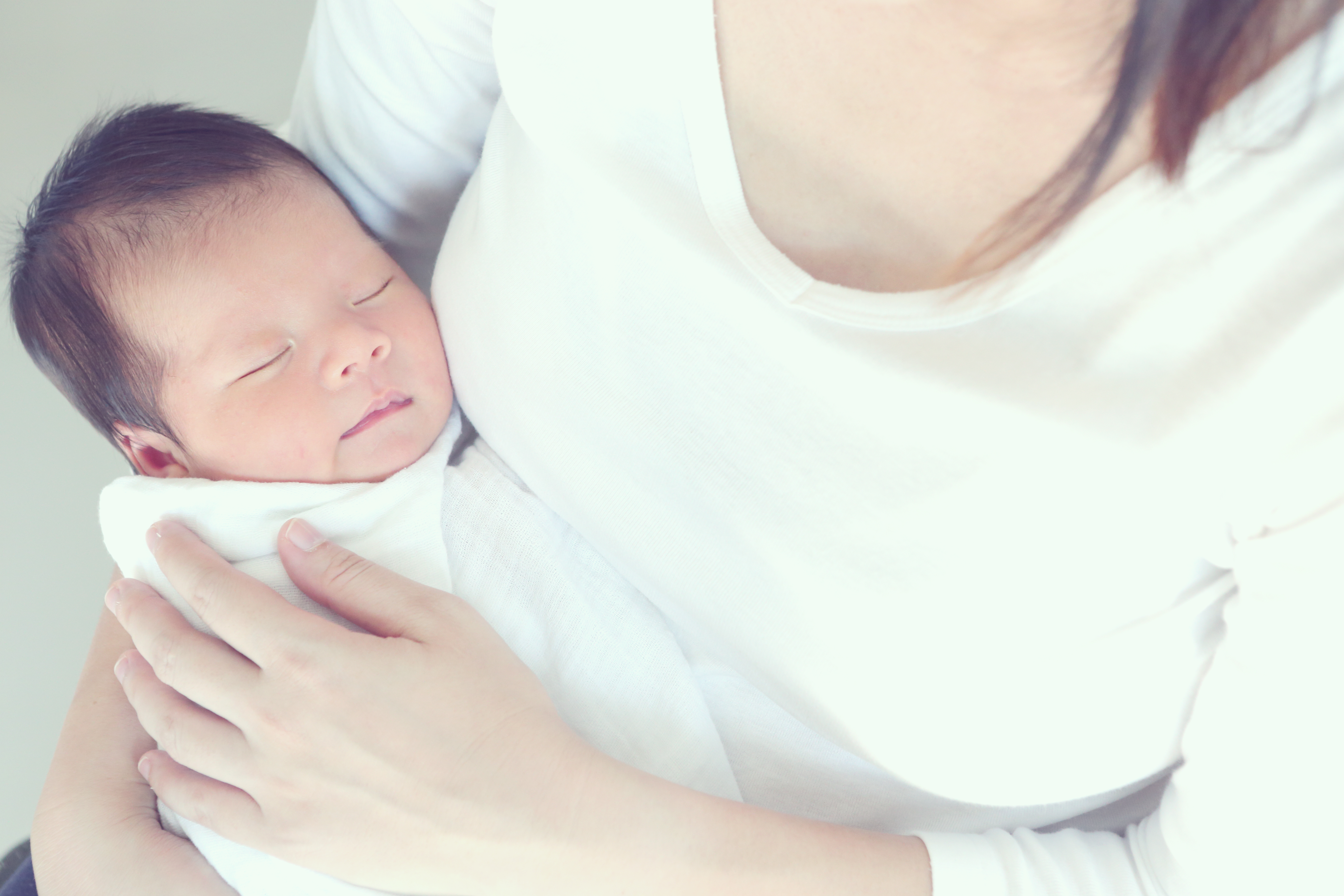 Mother holding feverish baby