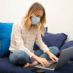 Woman with COVID-19 monitoring her vital signs