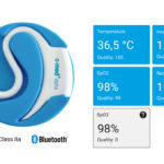 The in-ear sensor c-med° alpha and the visual display of the measured vital signs.