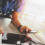 Doctor uses tablet and mobile phone for telemonitoring